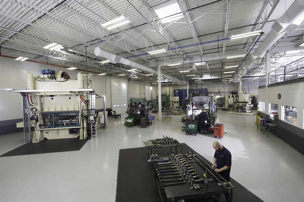 Shop floor of large metal working machinery operated by skilled technicians at Stewart EFI.