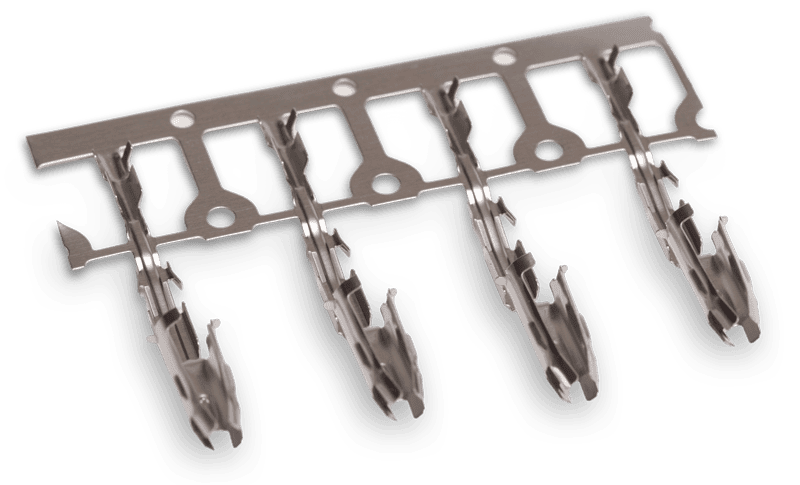 Stamped and formed metal electrical terminals on carrier strip, used for connector assembly.
